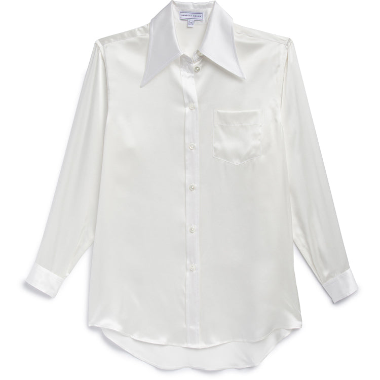 Indulge in the luxury of our ANNA MAY BLOUSE crafted from 100% Silk Charmeuse. The wide collar adds sophistication while the button down design exudes elegance. Elevate your wardrobe with this timeless piece, perfect for any occasion.